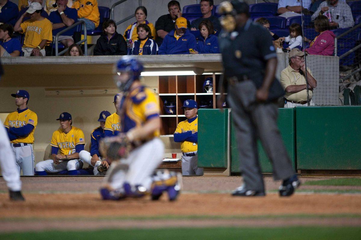 LSU coach Paul Mainieri watches from the dugout Thursday during the Tigers&#8217; 9-5 victory against Kentucky at Alex Box Stadium.