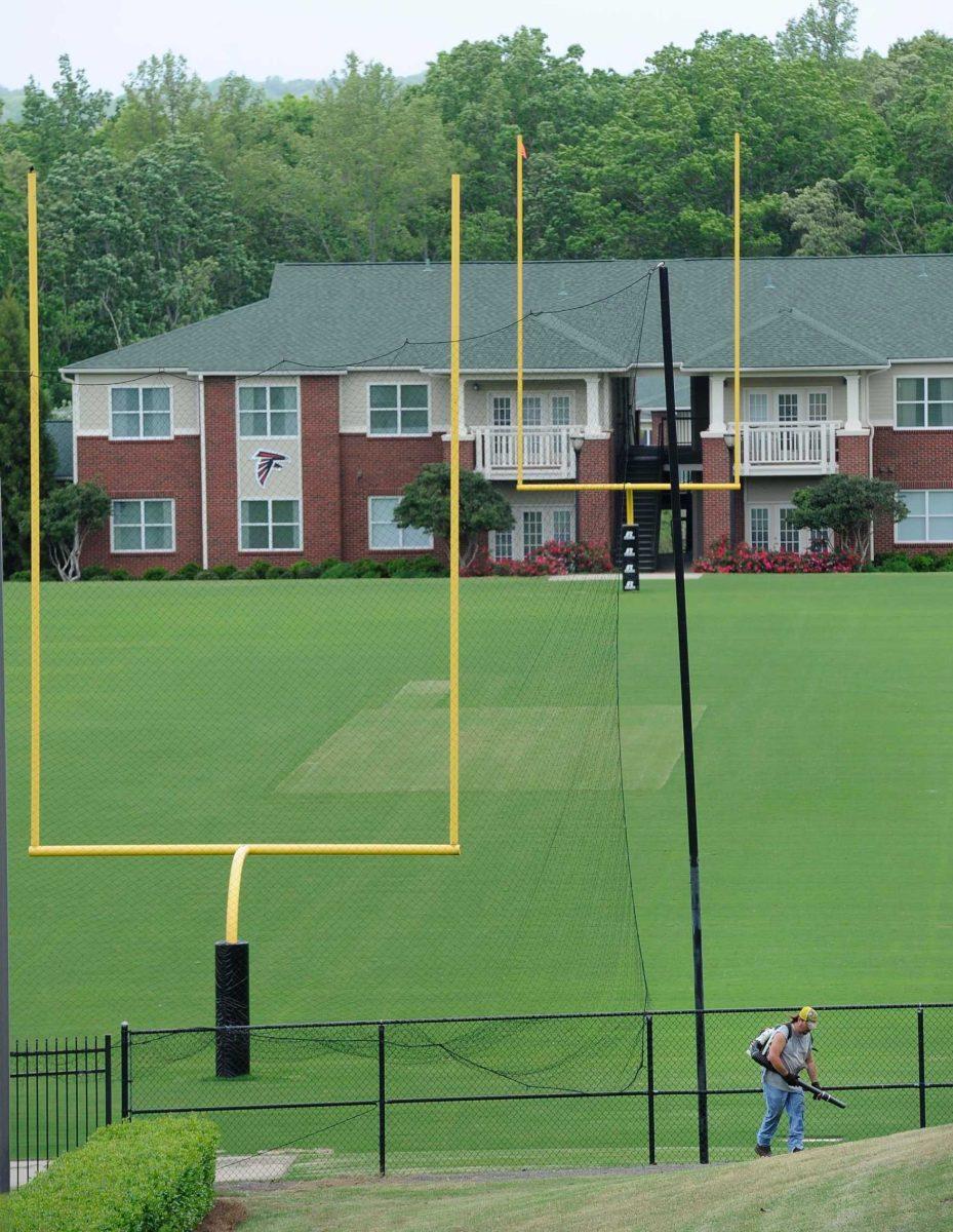 The Atlanta Falcons training facility&#8217;s practice field remains empty Tuesday in Flowery Branch, Ga. A federal judge lifted the NFL owners lockout on Monday.