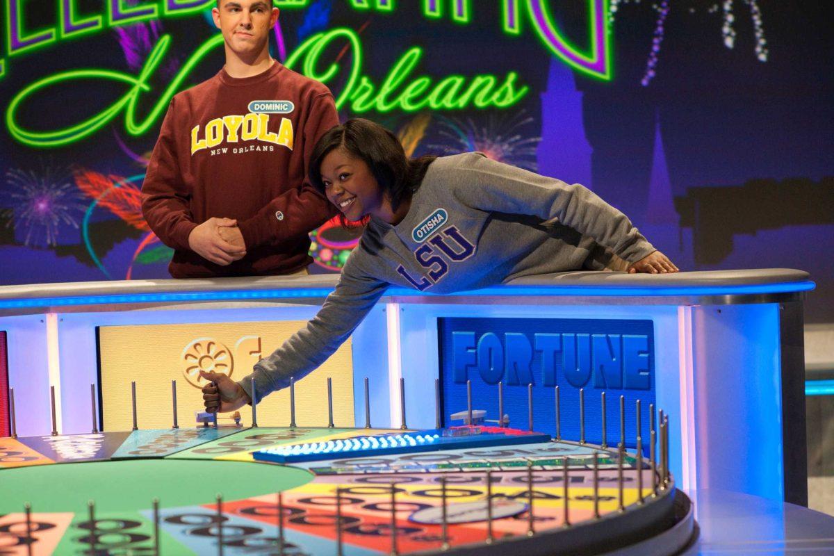 Otisha Reed, mass communication junior, spins the Wheel of Fortune on April 16 during the game show&#8217;s &#8220;College Week&#8221; series. See more photos from the taping at lsureveille.com.