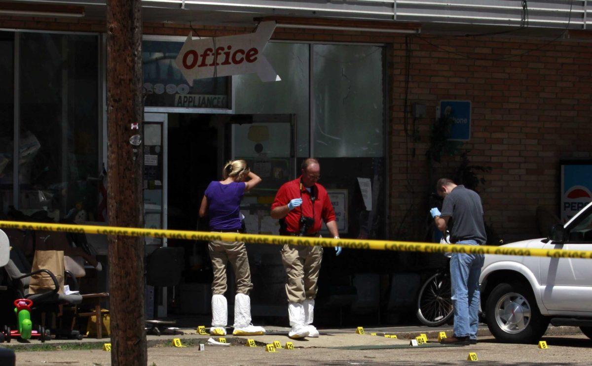 Investigators are seen outside the Bill Norris Appliance Center in Bossier City, La. Detectives at the scene Wednesday April 13, 2011, where three men were shot inside the appliance store late Tuesday afternoon. Police say the store's owner, 77-year-old William C. Norris and 58-year-old Jesse L. Burks, both of Bossier City, were pronounced dead at the scene. A third victim, 66-year-old Harold W. Arnett, died Wednesday at LSU Hospital in Shreveport.