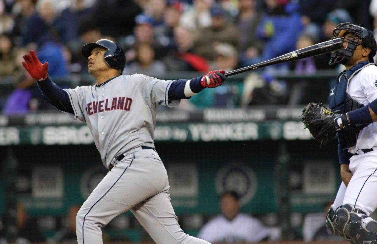 Cleveland Indians&#8217; Orlando Cabrera and Seattle Mariners catcher Miguel Olivo watch Cabrera&#8217;s sacrifice fly in the fourth inning of a baseball game Saturday in Seattle. Columnist Andy Schwehm predicts the Indians&#8217; pitching to be their downfall.