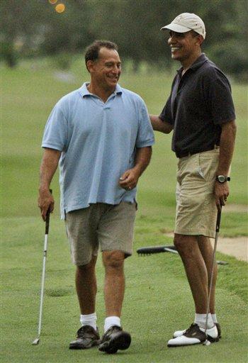 FILE - In this Dec. 31, 2009 file photo, President Barack Obama, right, laughs with Bobby Titcomb on the 18th green as they play golf at Mid Pacific Country Club in Kailua, Hawaii. Honolulu police say Titcomb was one of four men arrested in an undercover prostitution sting operation late Monday, April 4, 2011, and released on $500 bail.