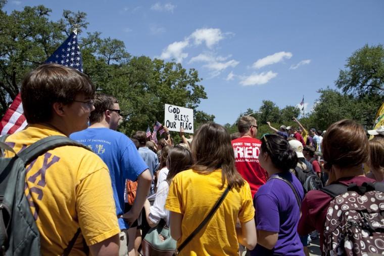 Angry crowd swarms for scheduled flag burning