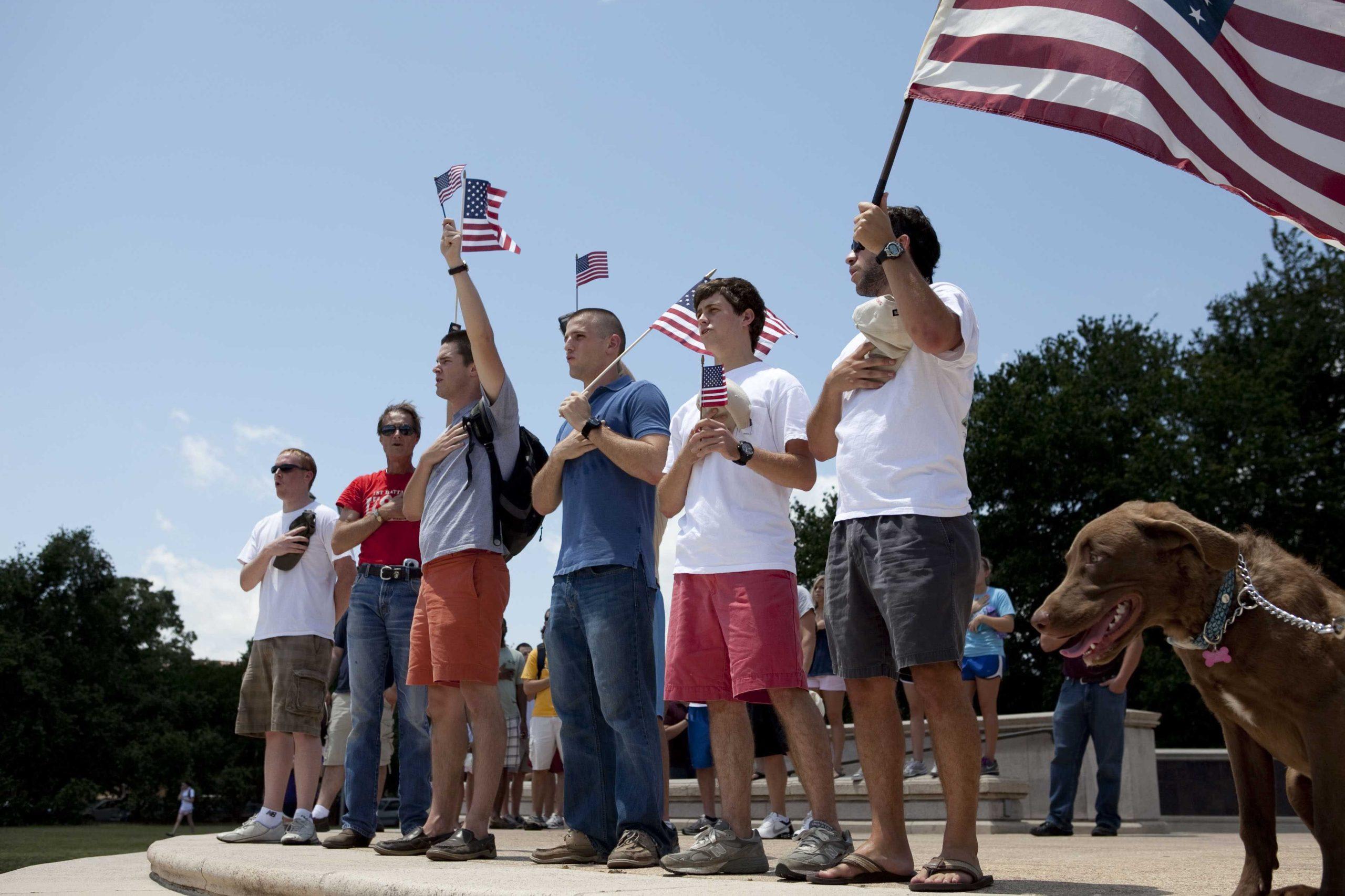 Angry crowd swarms for scheduled flag burning