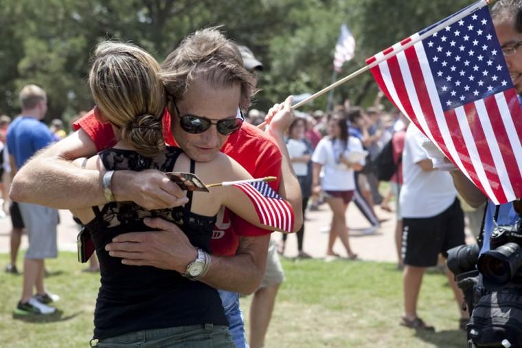 Angry crowd swarms for scheduled flag burning