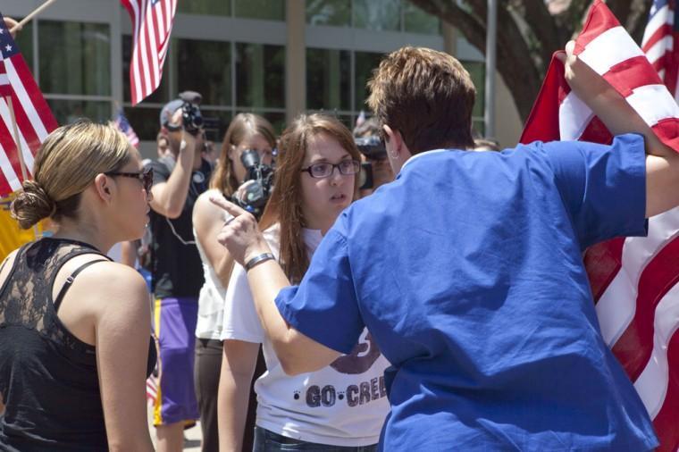 Angry crowd swarms for scheduled flag burning