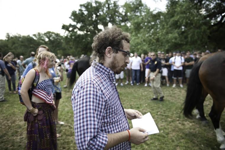 Angry crowd swarms for scheduled flag burning