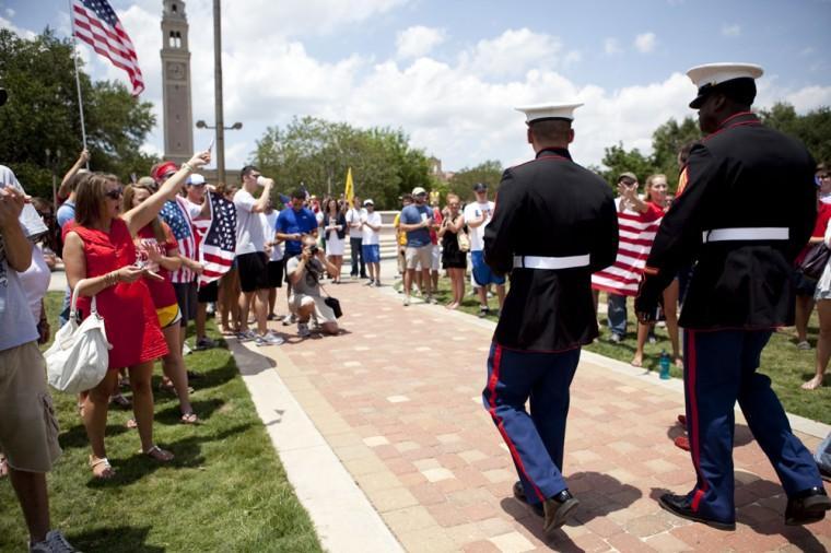 Angry crowd swarms for scheduled flag burning