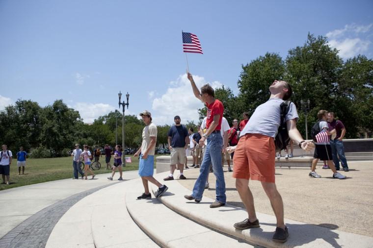 Angry crowd swarms for scheduled flag burning