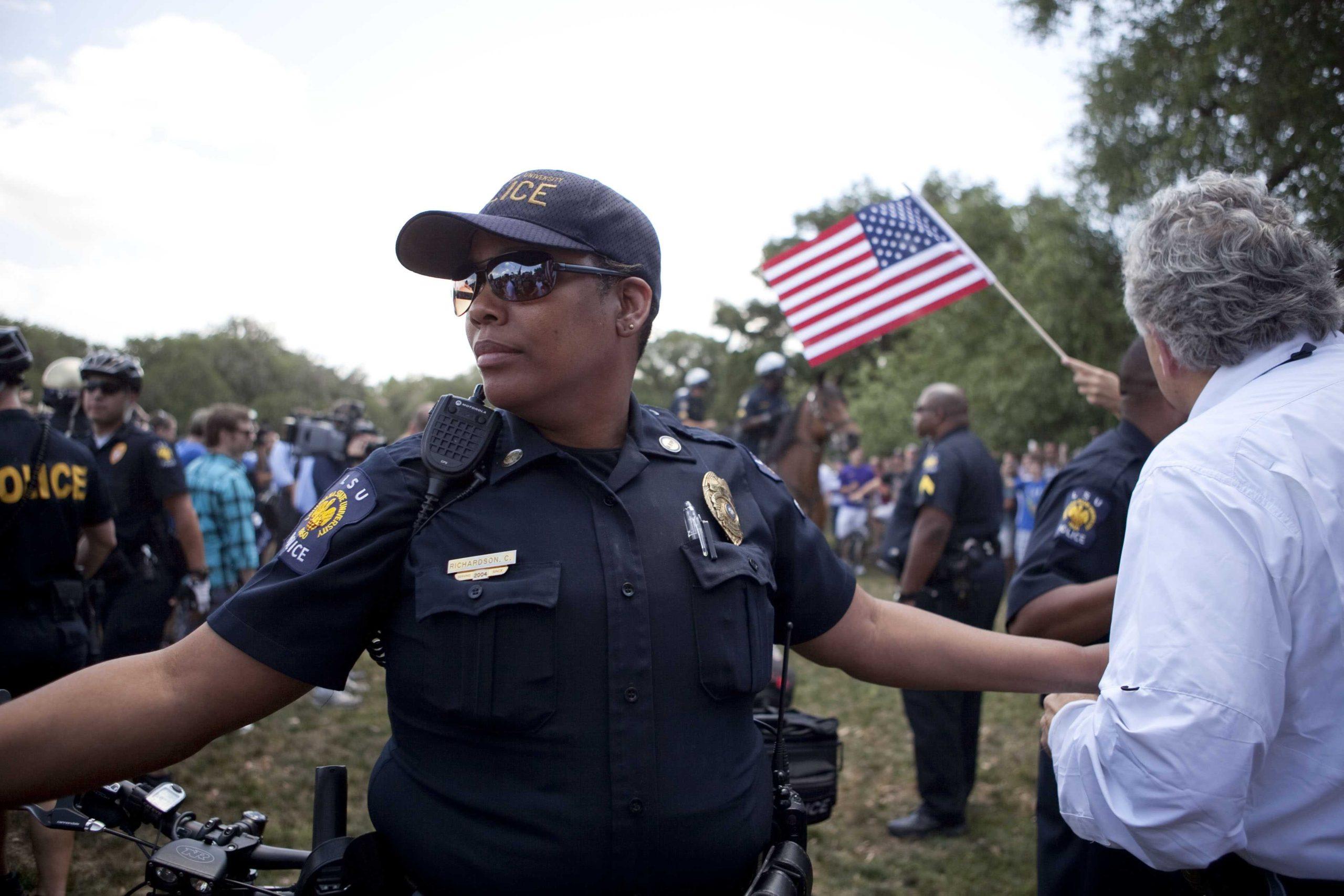 Angry crowd swarms for scheduled flag burning