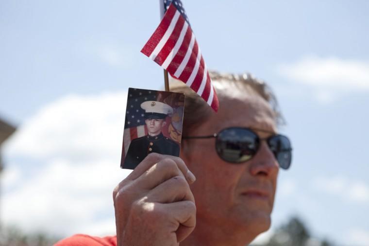 Angry crowd swarms for scheduled flag burning