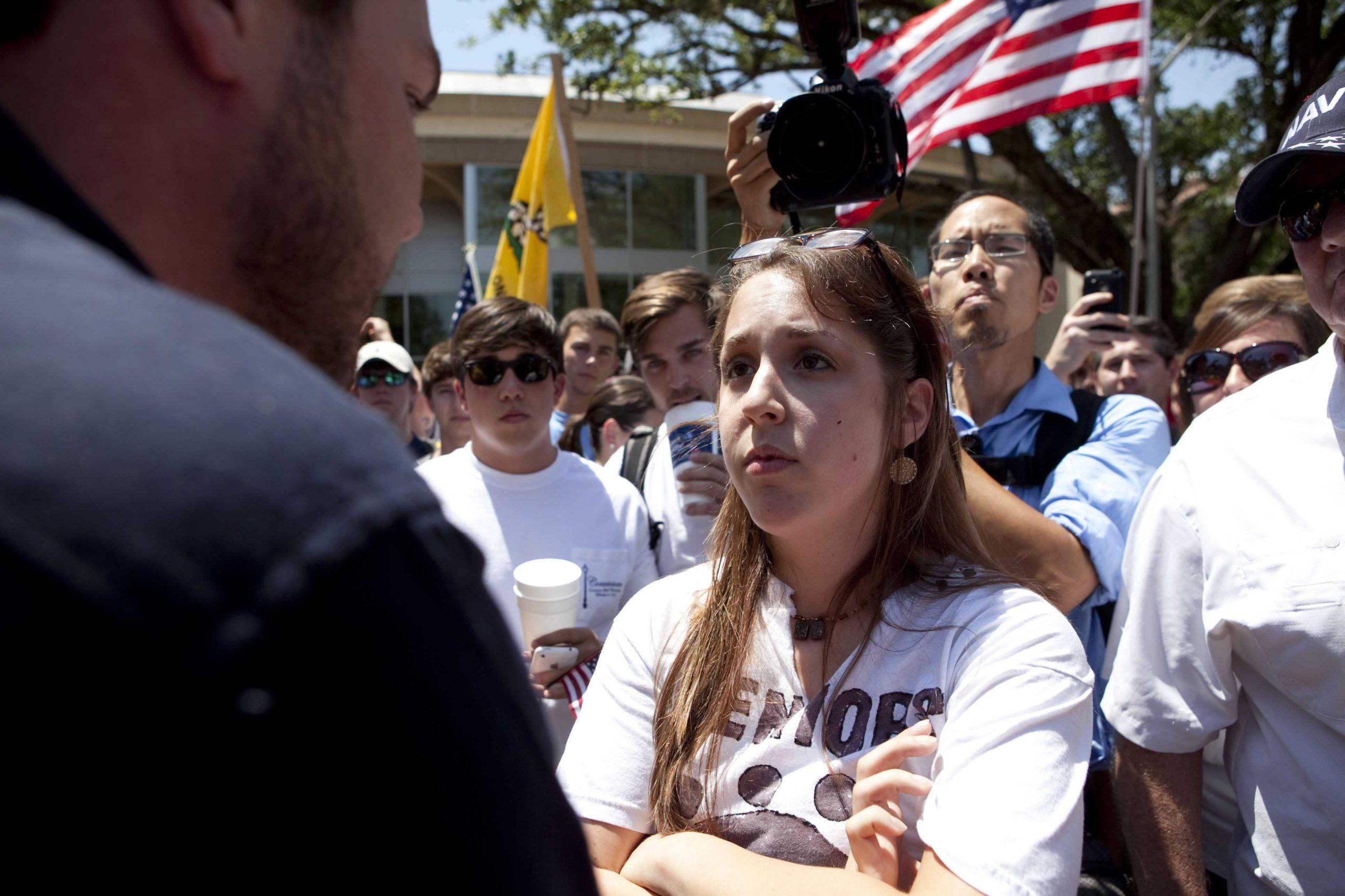 Angry crowd swarms for scheduled flag burning