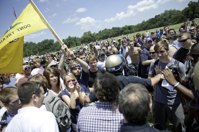 Angry crowd swarms for scheduled flag burning