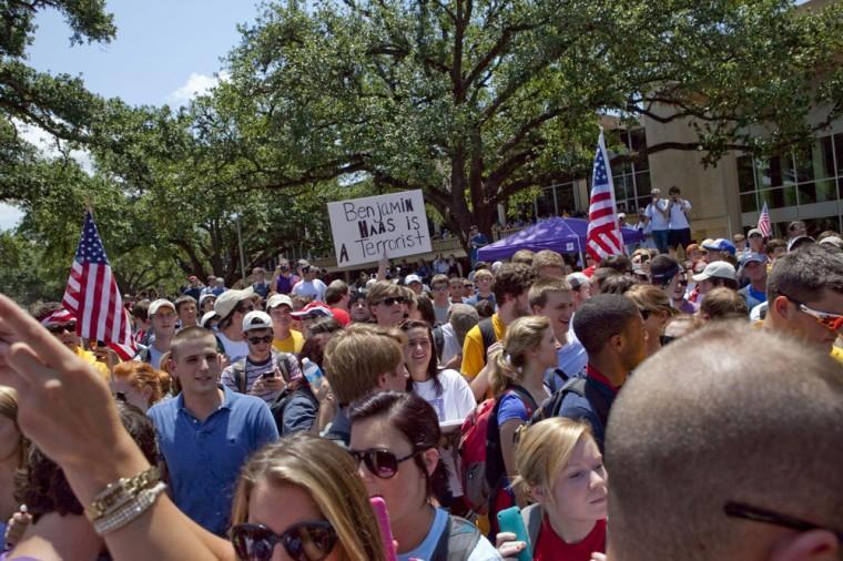 Angry crowd swarms for scheduled flag burning