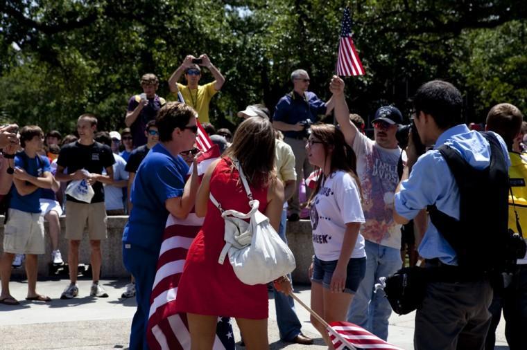 Angry crowd swarms for scheduled flag burning