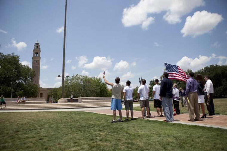 Angry crowd swarms for scheduled flag burning