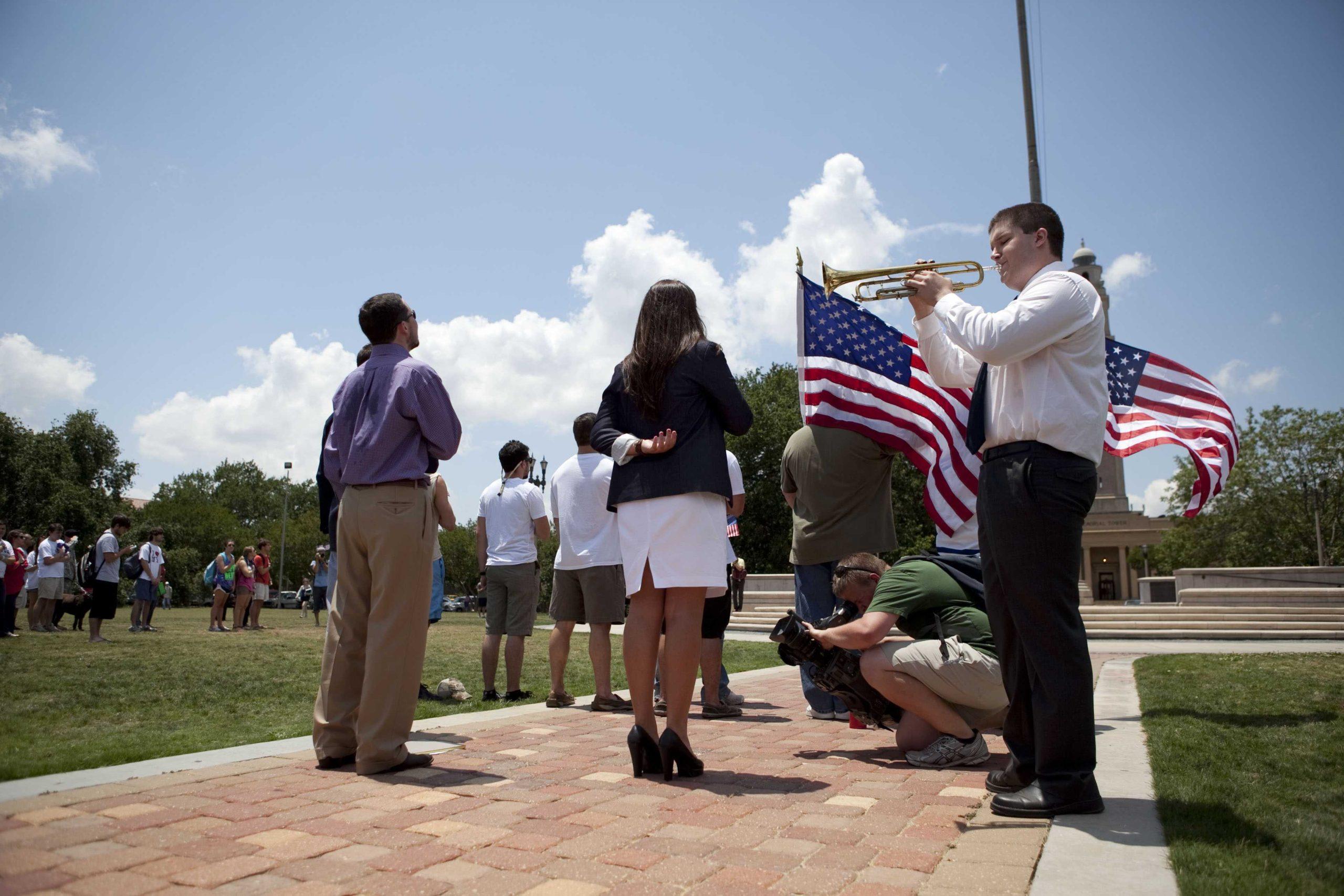 Angry crowd swarms for scheduled flag burning