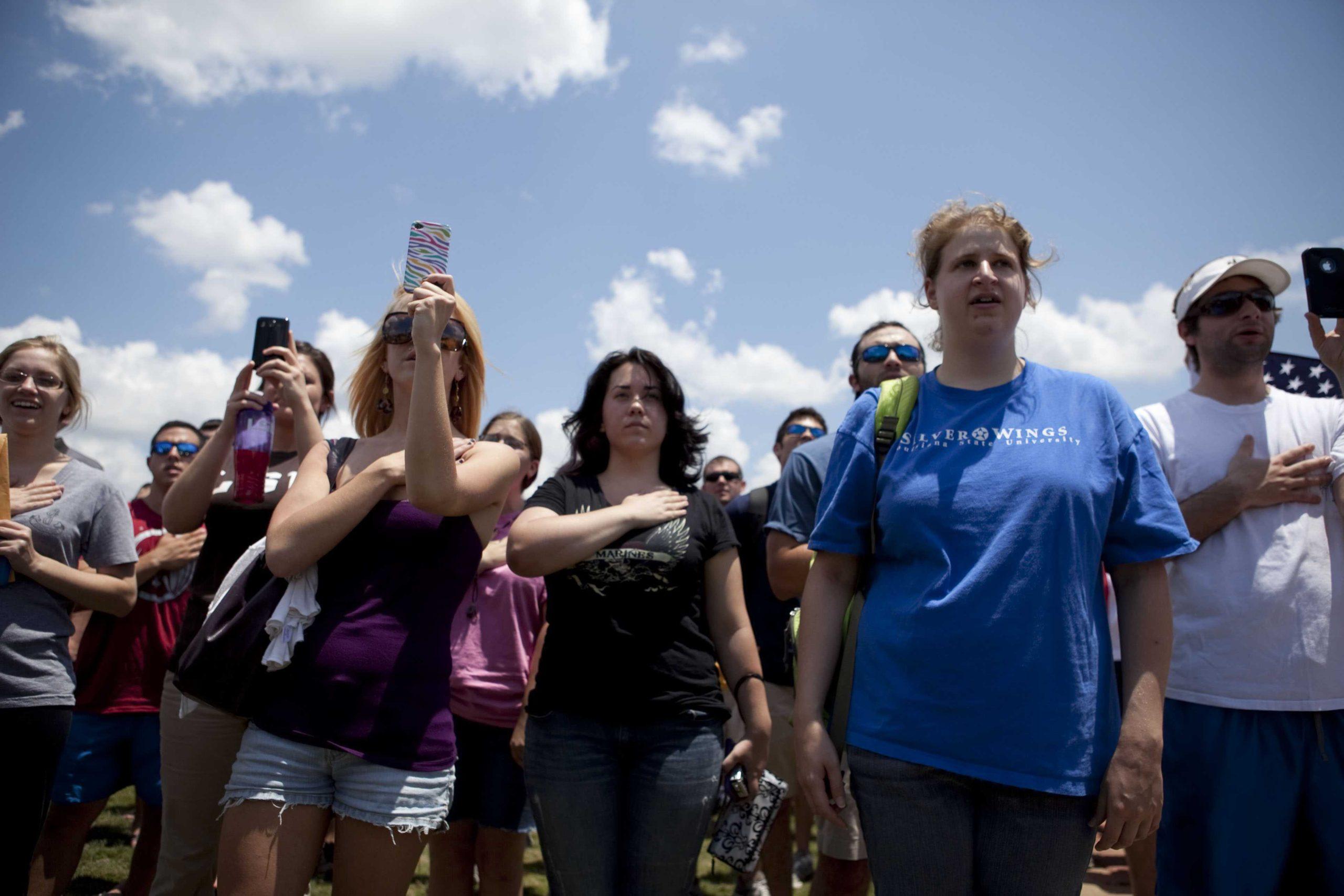 Angry crowd swarms for scheduled flag burning