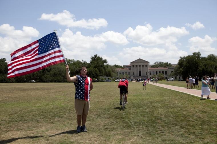 Angry crowd swarms for scheduled flag burning