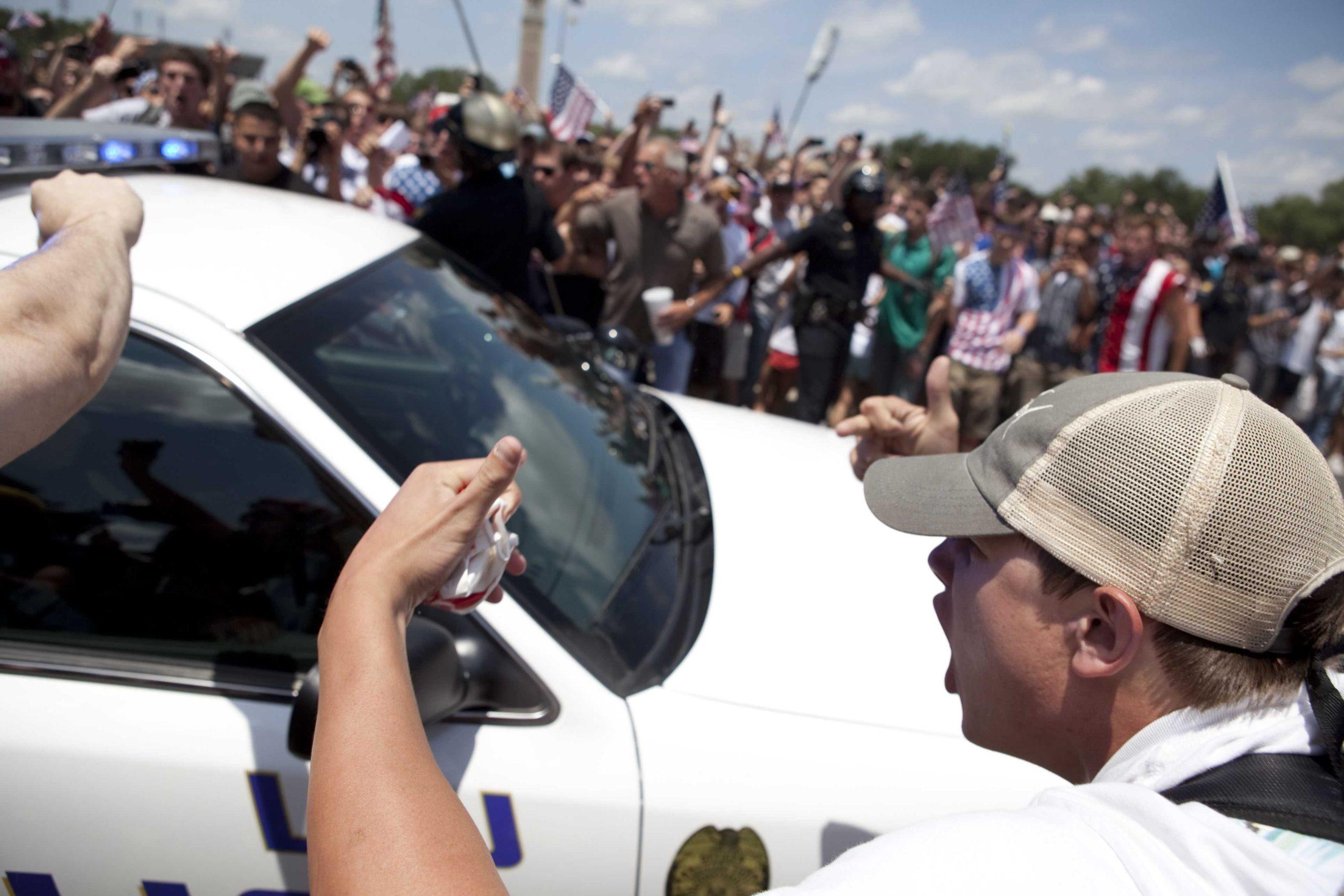 Angry crowd swarms for scheduled flag burning