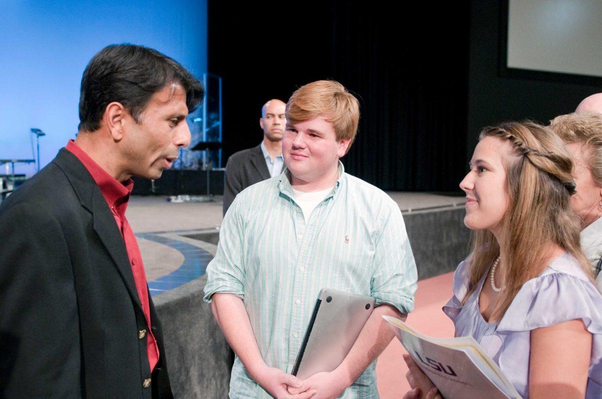 J Hudson and Dani Borel, former SG president and vice president, speak with Gov. Bobby Jindal on Nov. 1. in Denham Springs.