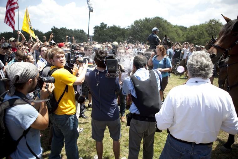 Angry crowd swarms for scheduled flag burning