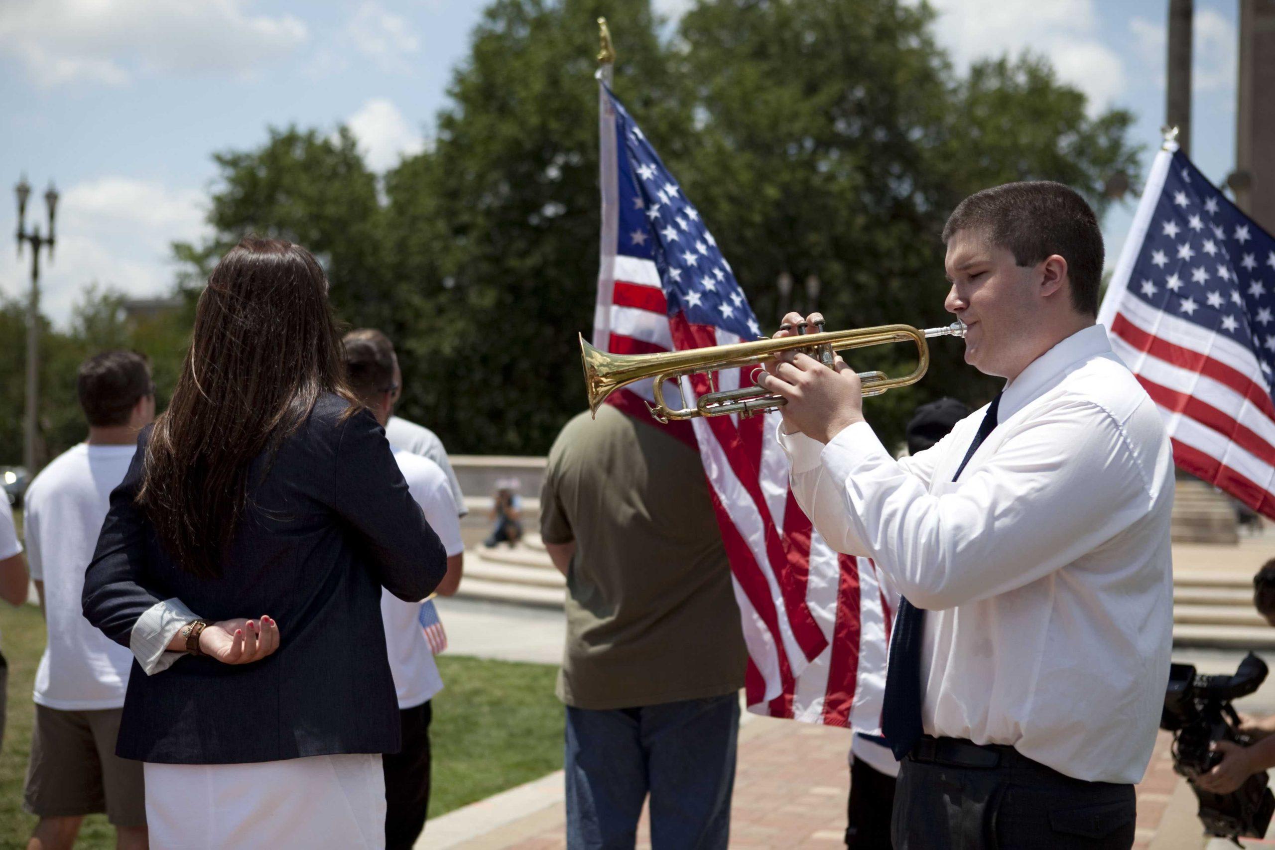 Angry crowd swarms for scheduled flag burning