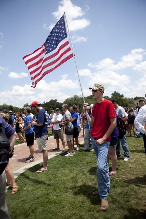 Angry crowd swarms for scheduled flag burning