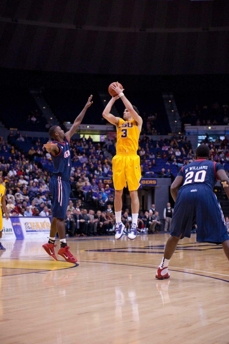 Junior forward Garrett Green attempts a three-point shot in a January 2011 game against the Old Miss Rebels in the PMAC. The Tigers lost to the Rebels 78-51.