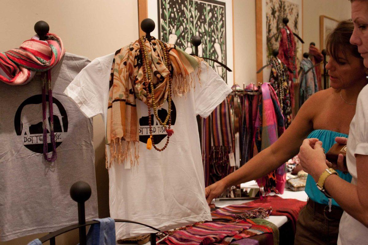 Customers at the Dotted Tusks&#8217;s opening show look at the original and exotic clothing Aug. 27 in the Lod Cook LSU Alumni Center.