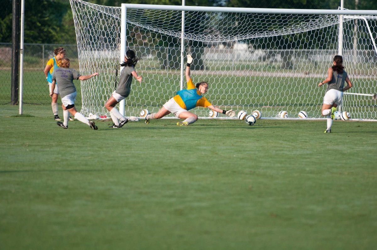 LSU goalkeeper Mo Isom makes a save at practice Tuesday at the LSU Soccer Stadium.