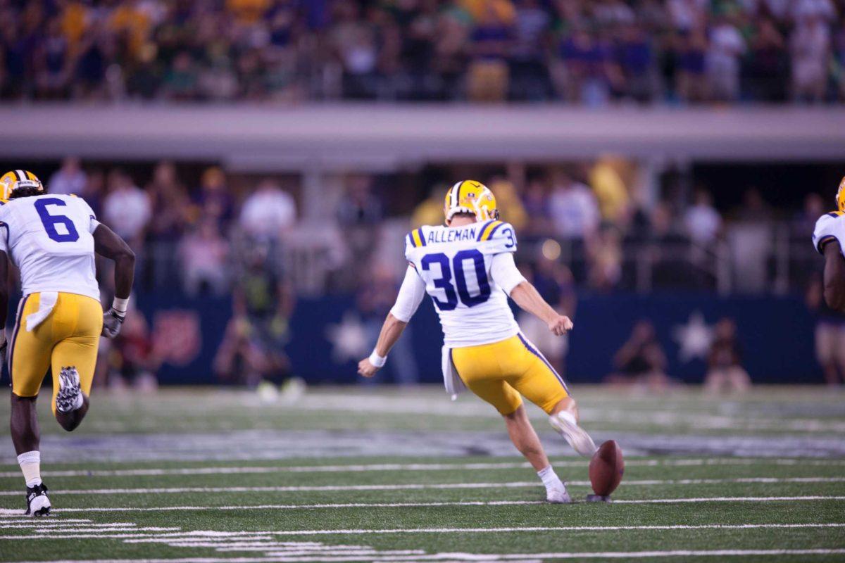 Junior kicker Drew Alleman kicks off against Oregon on Sept. 3 in Cowboys Stadium. Alleman has averaged 57 yards per kickoff this season.