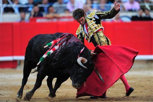 Bullfighter Jose Tomas performs at the Monumental bullring in Barcelona on Sunday at a farewell fight before a polemical ban for Catalonia takes effect.