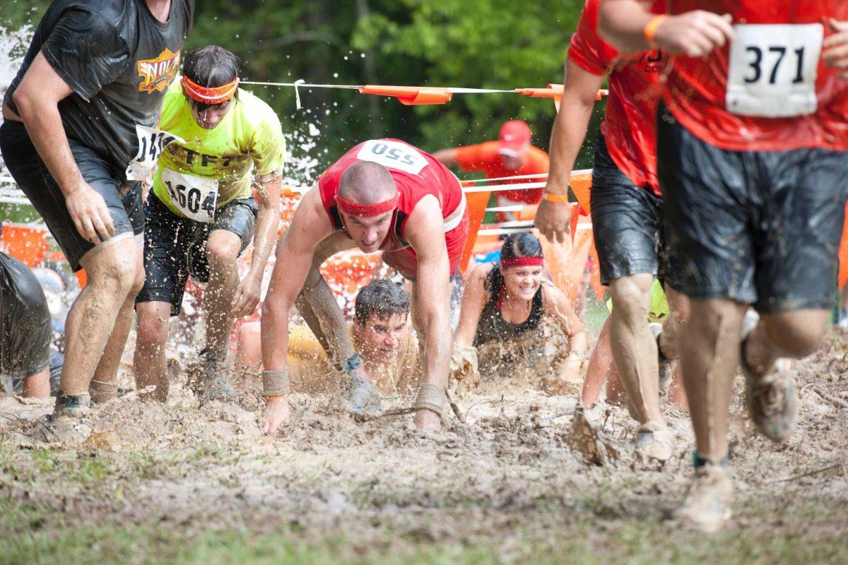 Participants make their way through the giant mud pit Saturday during the Play Dirty Adventure Trail Run at the Baton Rouge Fairgrounds. The event raised money for Rocket Kidz Foundation, an organization battling childhood obesity.