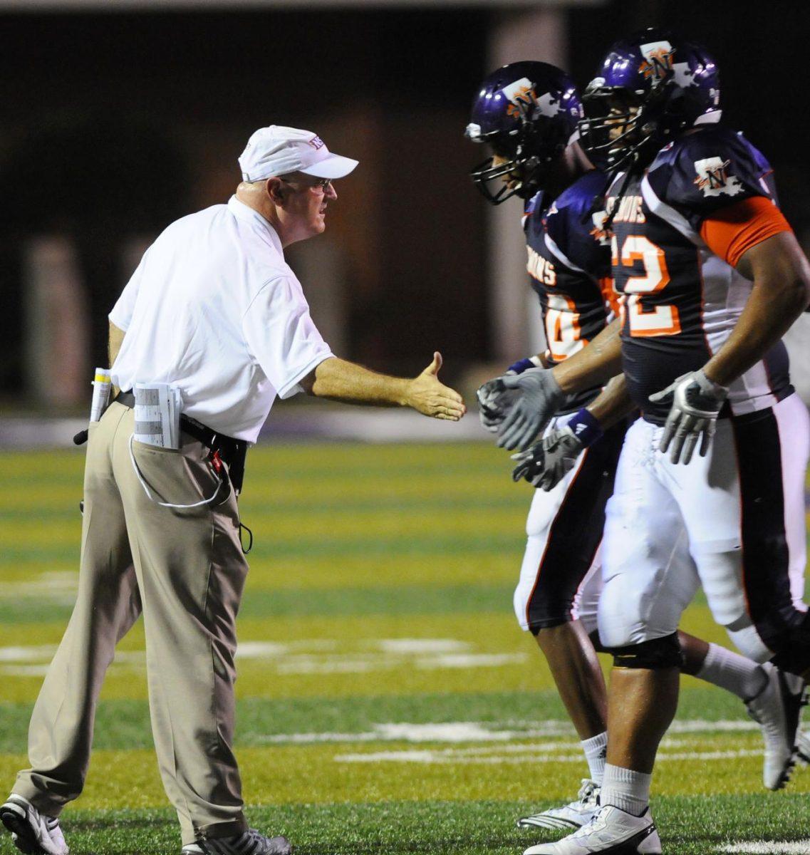 Two Northwestern State players run onto the field. The Demons haven&#8217;t beaten or scored on the Tigers in 10 matchups.