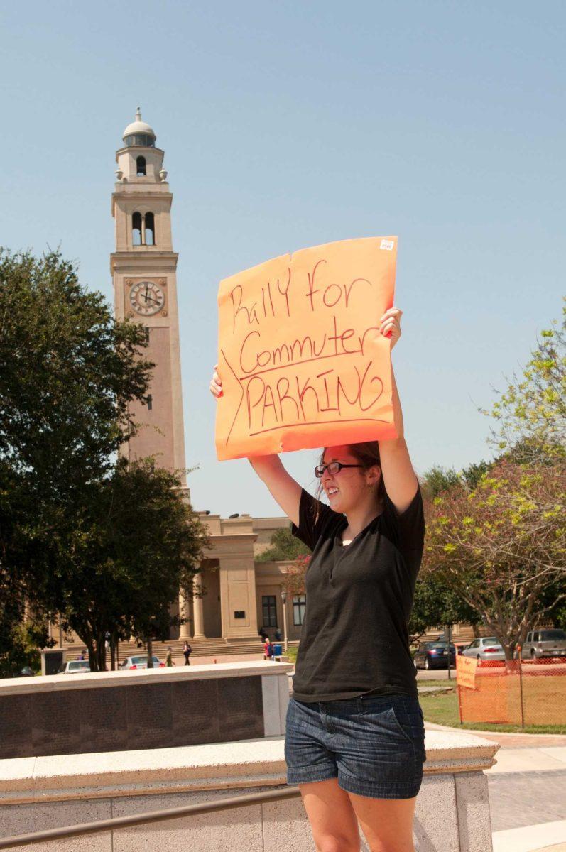 Communications studies junior Shelby Taylor petitions for better parking Friday during the commuter parking rally on the Parade Ground.