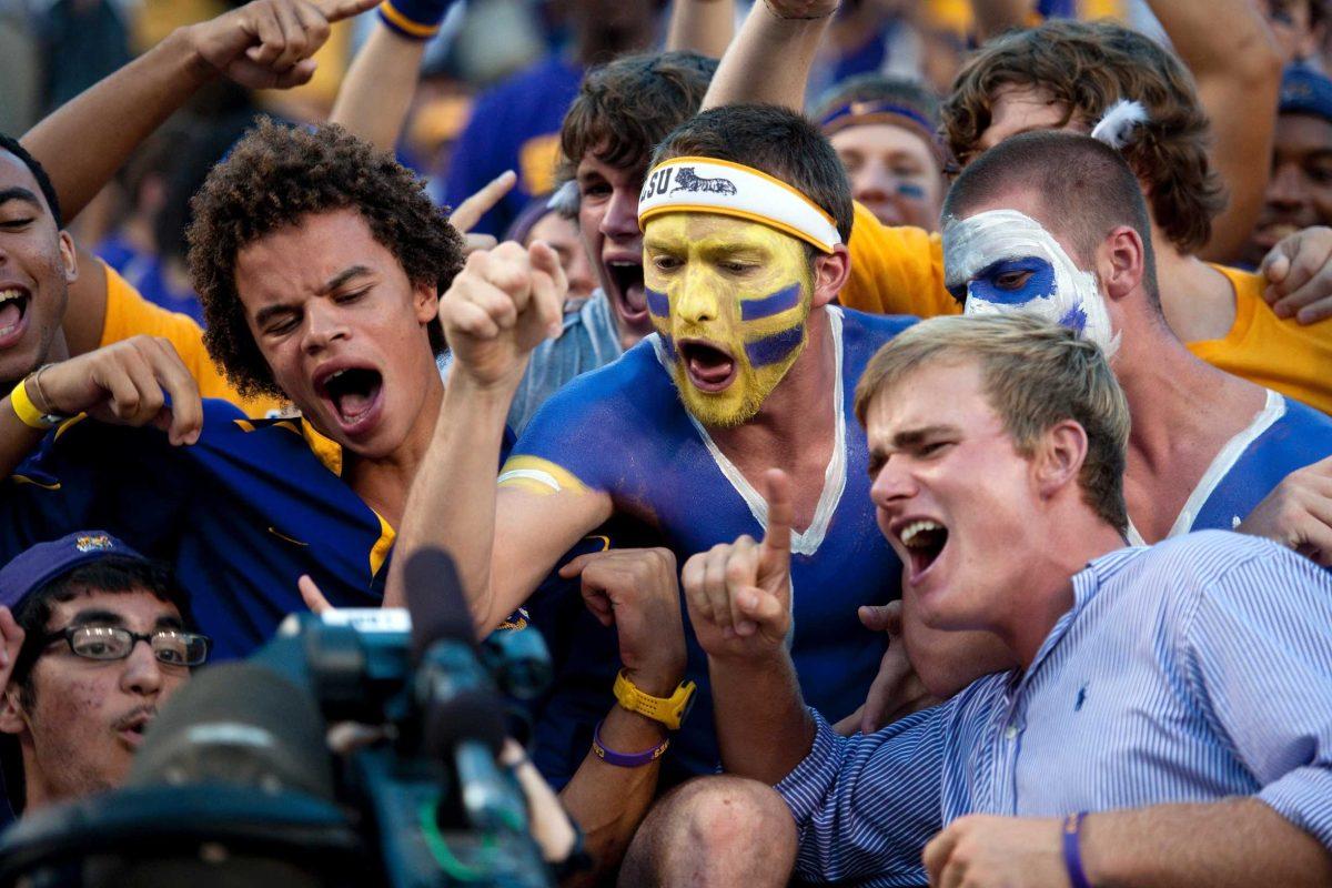 Fans in the student section show off their school spirit for an ESPN camera before the West Virginia game Saturday, Sept. 25, 2010, in Tiger Stadium.