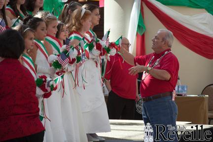 Nickie Dimaio, co-chairman of the festa and founding member of AIA, directs the Italian Festa Maids on stage Sunday at the Belle of Baton Rouge Casino and Hotel.