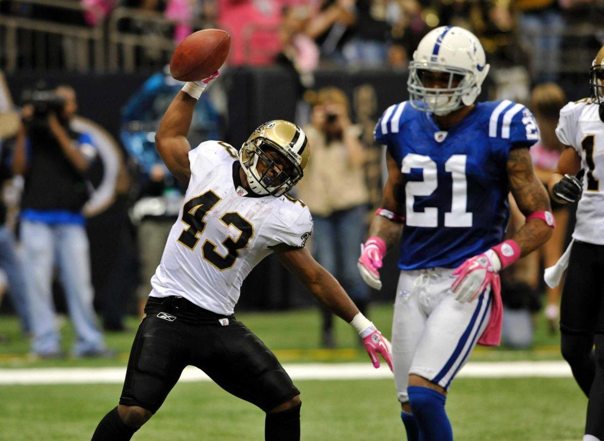 New Orleans Saints running back Darren Sproles (43) spikes the ball after his touchdown during the fourth quarter of an NFL football game at the Superdome in New Orleans, Sunday, Oct. 23, 2011. The Saints won 62-7.