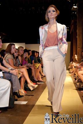 A model walks the runway in NOLA Fashion Week on Saturday at the Ogden Museum of Art. Student volunteers are helping designers with shows and errands.