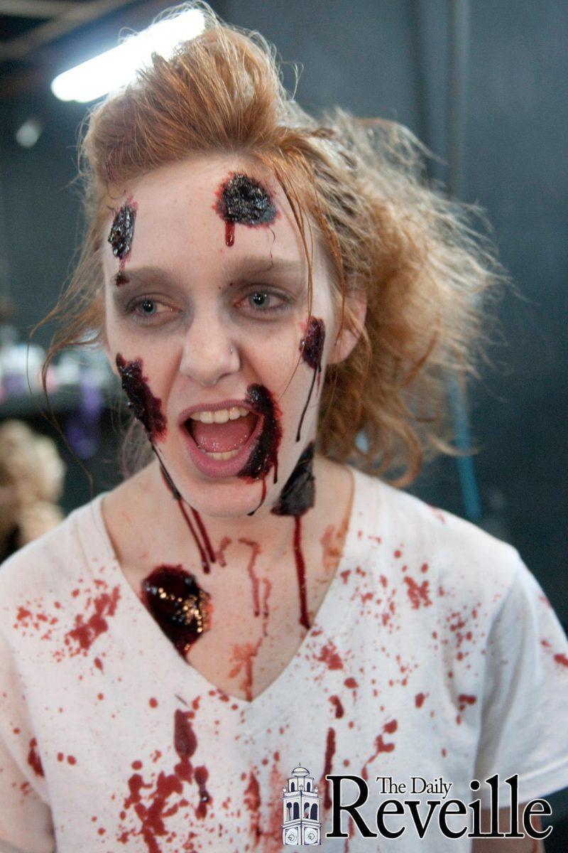 Stephanie Cronan, French sophomore, transforms into a zombie Saturday night at The 13th Gate haunted house downtown, which has recently expanded and is in its 10th season of scaring Baton Rouge.