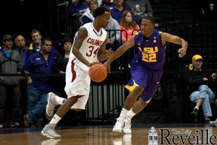 LSU sophomore guard Ralston Turner (22) defends Nicholls State guard Jeremy Smith during the Nov. 12 game at the PMAC.