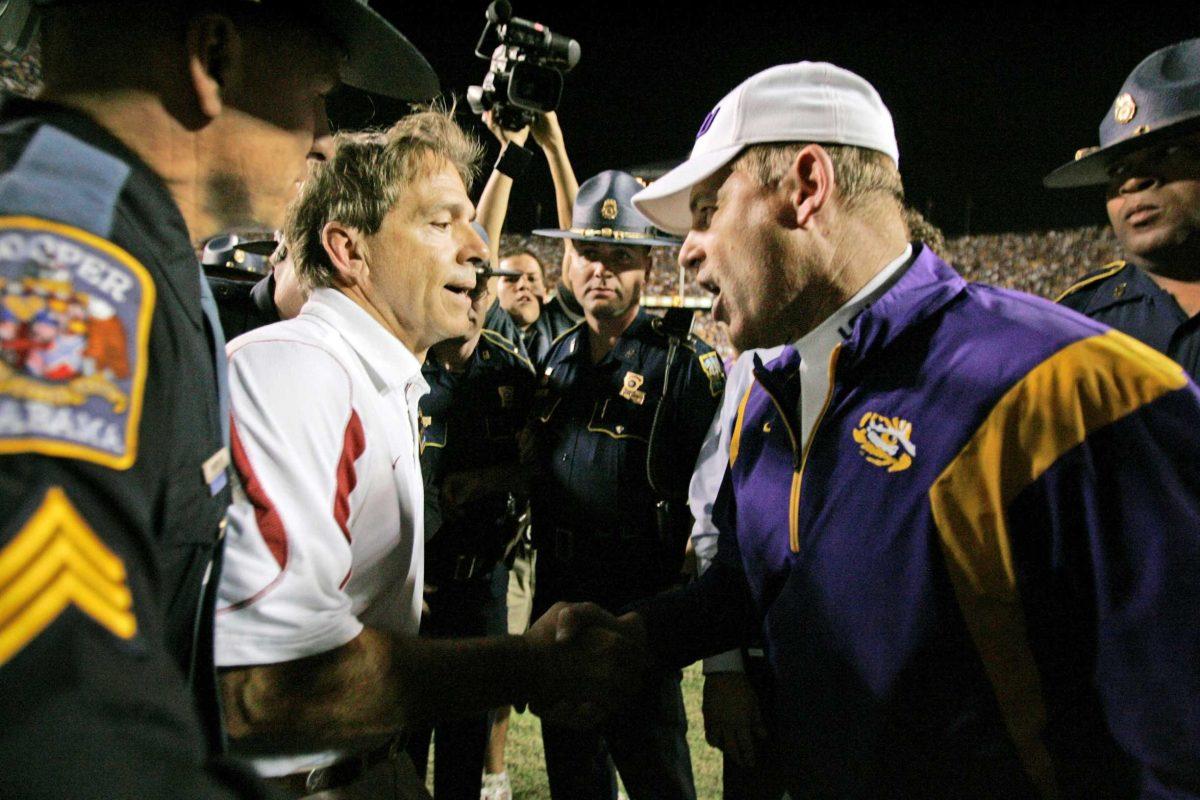 Alabama coach Nick Saban and LSU coach Les Miles shake hands following Alabama&#8217;s 27-21 overtime win Nov. 8, 2008 in Baton Rouge.