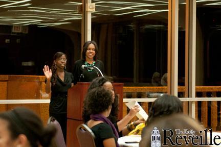 Markita Lewis, nutrition sophomore, and Janae David, textiles, apparel design and merchandising junior welcome people Tuesday to the Pre-Kwanazaa Celebration.