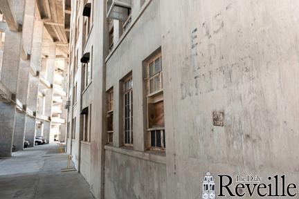 A faded painted sign reads "East Stadium Dormitory" on the exterior walls of Tiger Stadium.