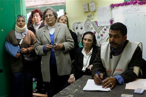 Egyptian women wait to vote in the country's parliamentary election in the Zamalek neighborhood of Cairo, Egypt, Monday, Nov. 28, 2011. Shaking off years of political apathy, Egyptians on Monday began voting in their nation's first parliamentary elections since Hosni Mubarak's ouster, a giant step toward what many in the country hope will be a democratic Egypt after decades of dictatorship.