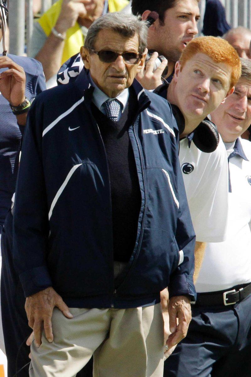 Former Penn State head football coach Joe Paterno, left, and assistant coach Mike McQueary stand on the sidelines during the Sept. 24 game against Eastern Michigan in State College, Pa.