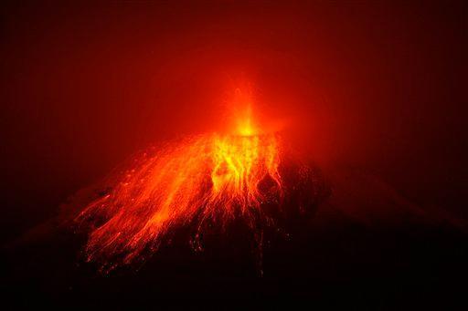 The Tungurahua volcano spews ashes during an eruption seen from Cotalo, Ecuador, Tuesday, Nov. 29, 2011. Ecuador's Geophysical Institute says increased activity that began Sunday is billowing columns of ash, sending superheated clouds of gas down the slopes and cascading hot rocks from the summit. (AP Photo/Dolores Ochoa)