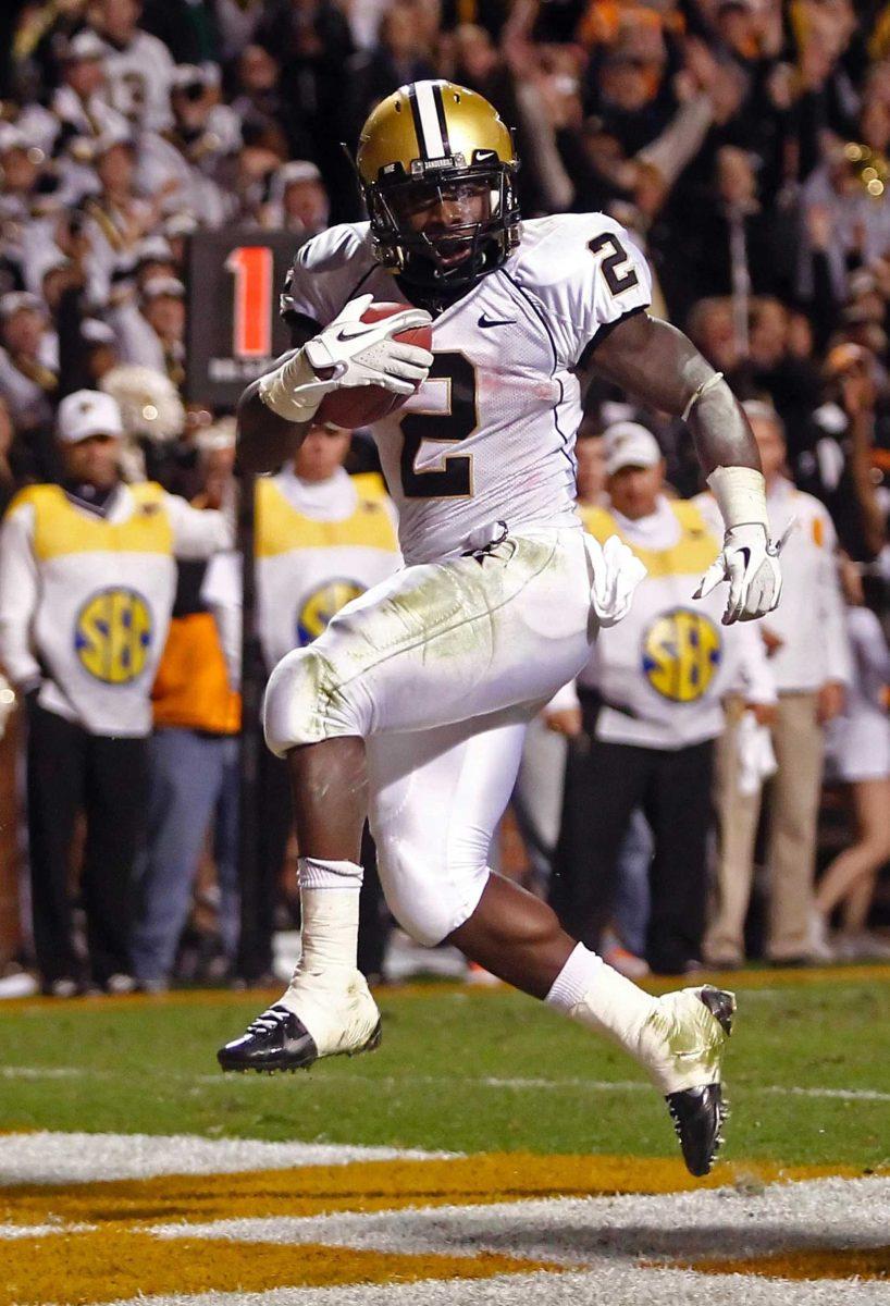 Vanderbilt's running back Zac Stacy (2) scores a touchdown in the second quarter of an NCAA college football game against Tennessee on Saturday, Nov. 19, 2011, in Knoxville, Tenn. (AP Photo/Wade Payne)