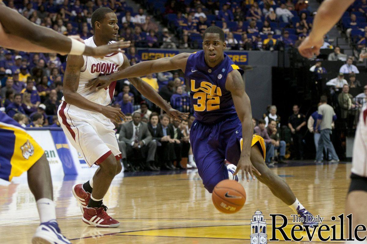 LSU freshman guard John Isaac (32) moves past Nicholls defenders during the Tigers' 96-74 victory against the Colonels Saturday, Nov. 12, 2011, at Tiger Stadium.